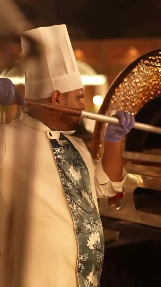 Catering film still of a chef at a live cooking station